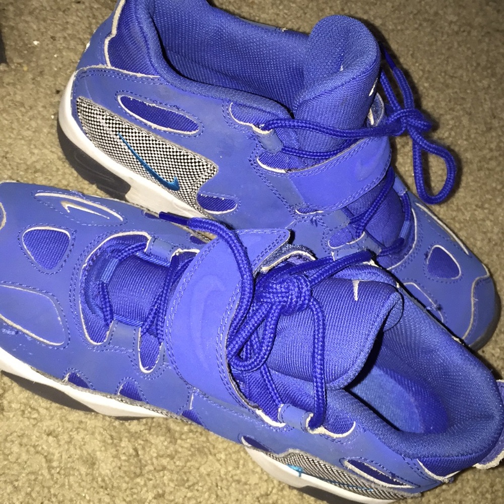 White/blue/black nike shoes .